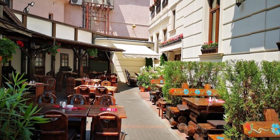 Bucharest: Street Food Tour with a Local Guide - Bucharest through a pretzel, a tram, and a market