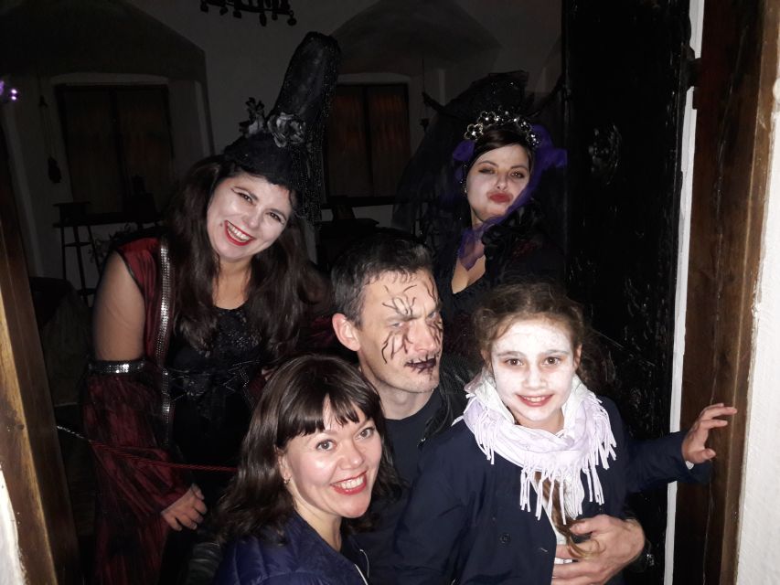 From Brasov: Halloween Party at Bran Castle - The welcome in Bran: wine, palinca, and snacks